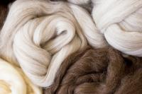 Hand knitted natural wool scarf.